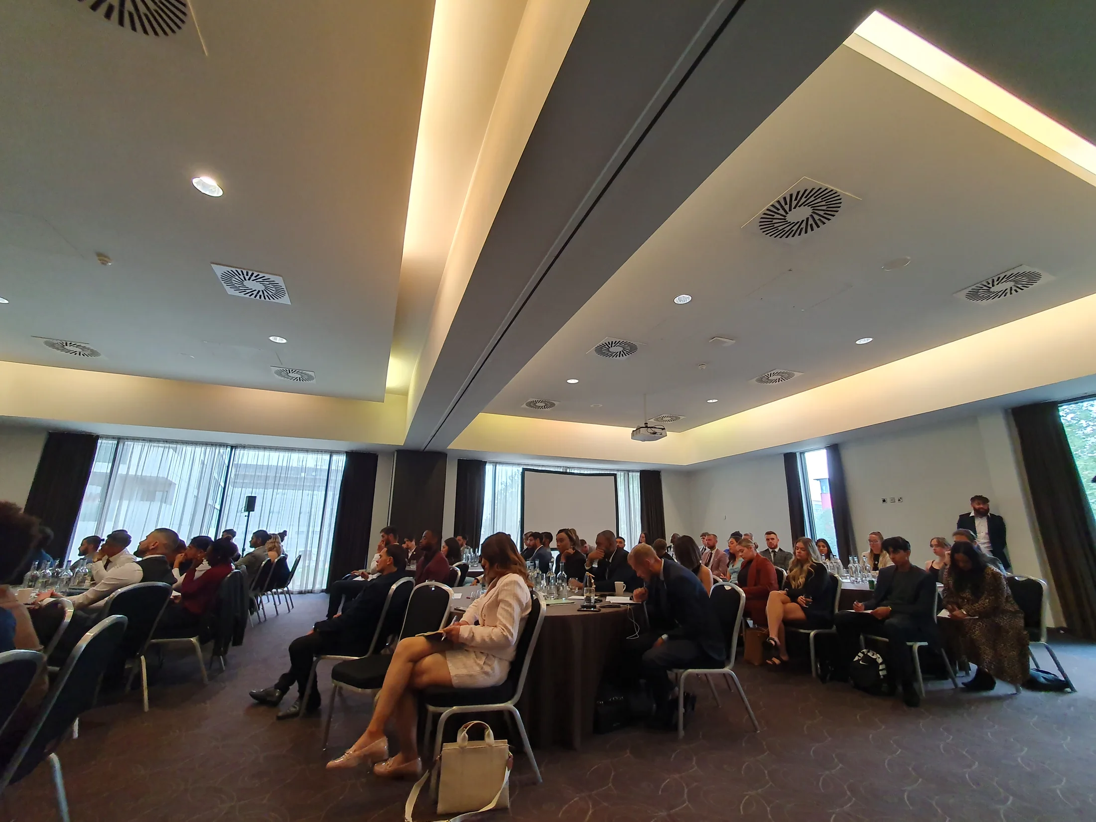 A large group attending a presentation