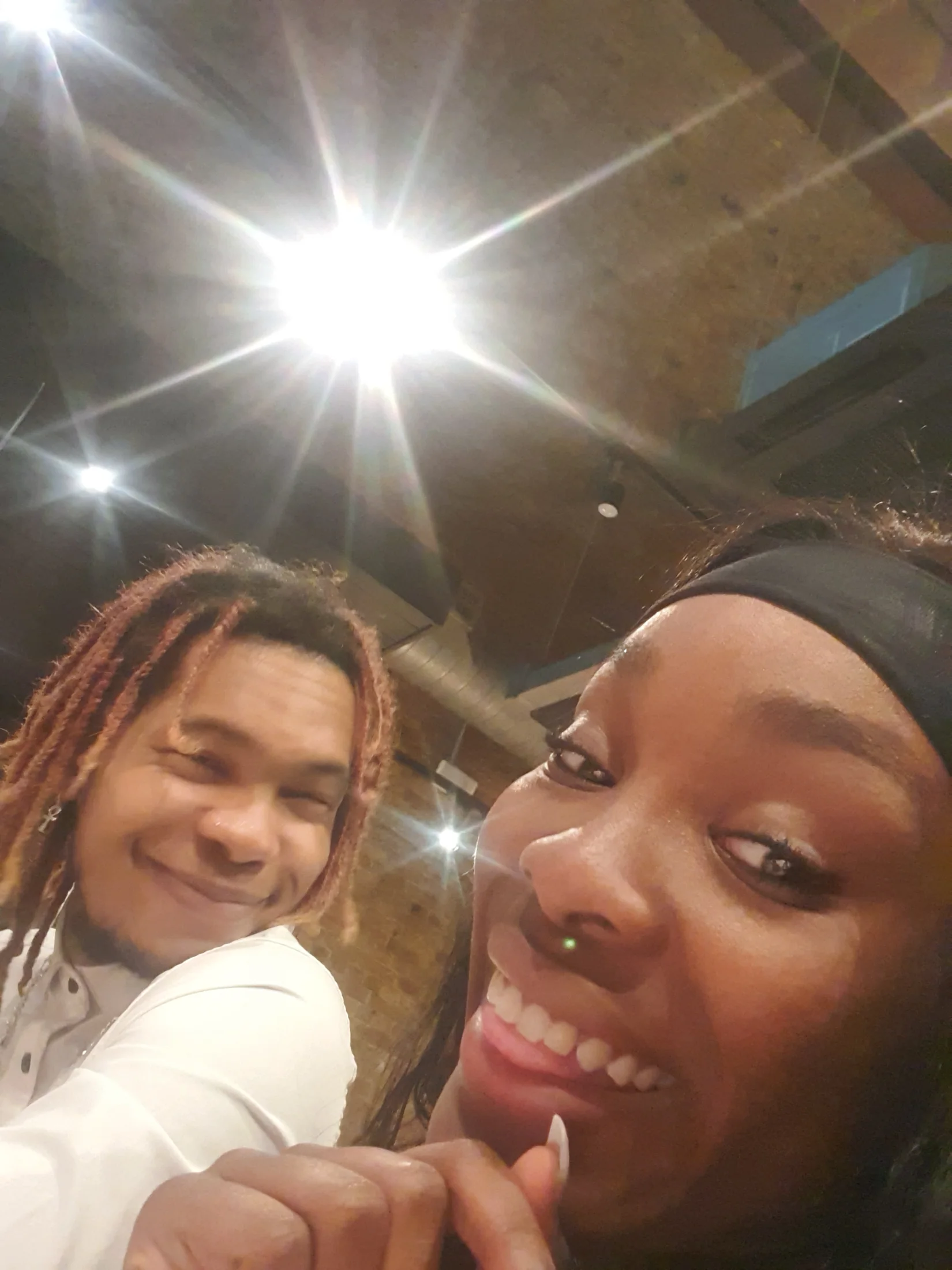 Two team members smiling together