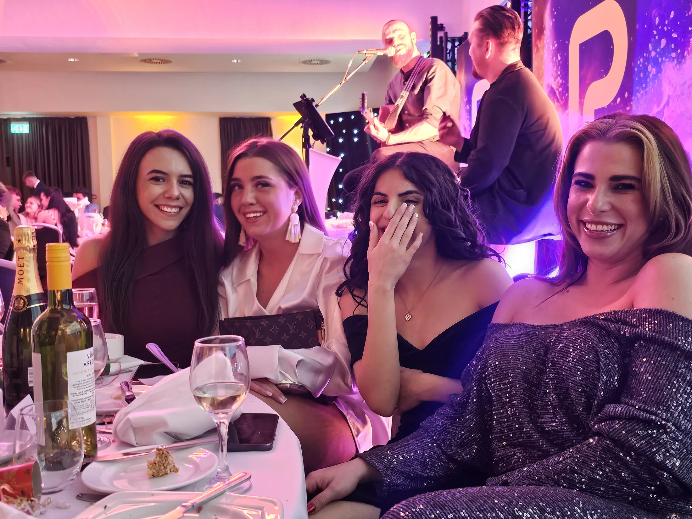 Team members together at a dinner event