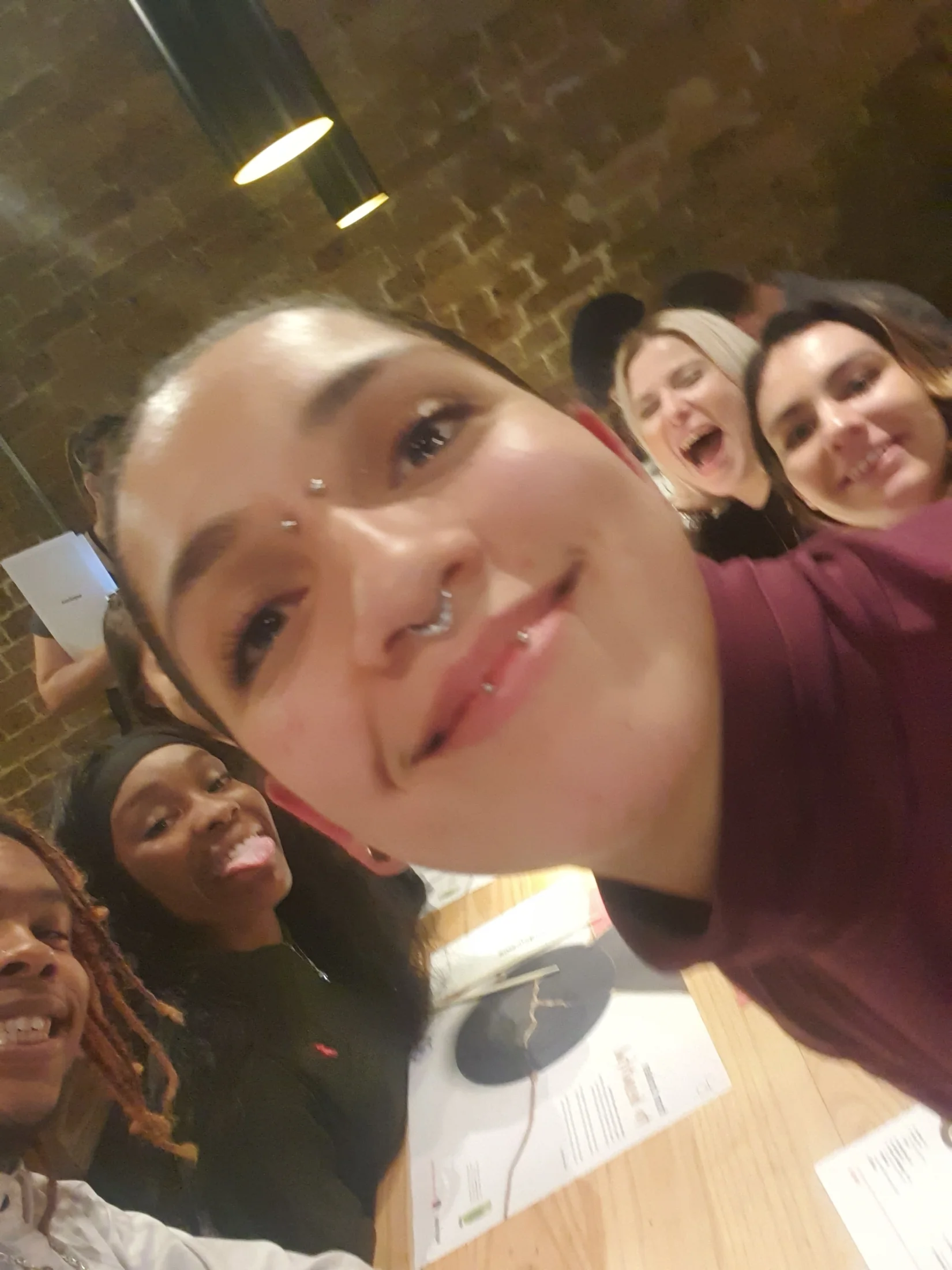 Team members smiling together in a close-up photograph