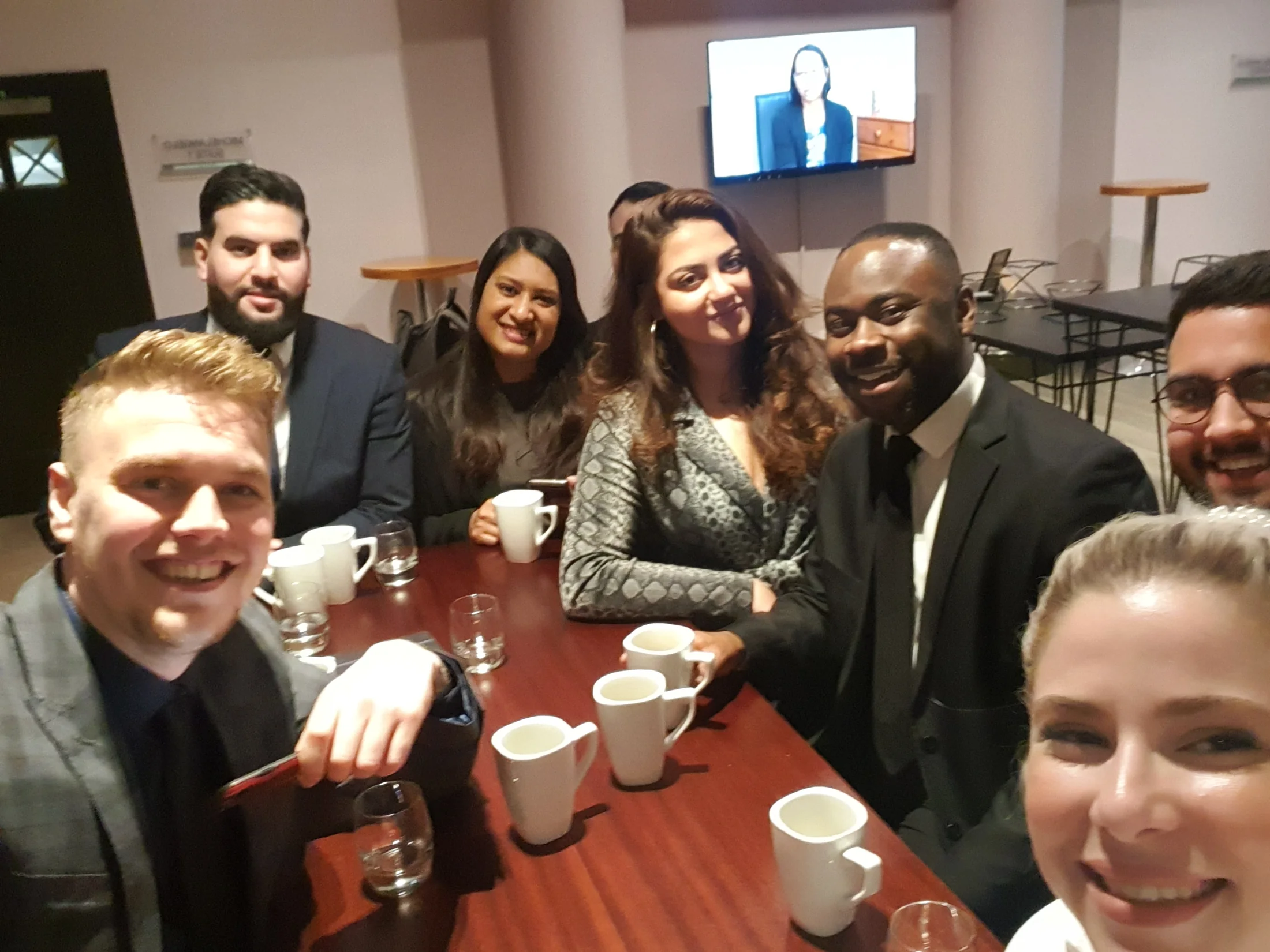 Team members gathered around a table